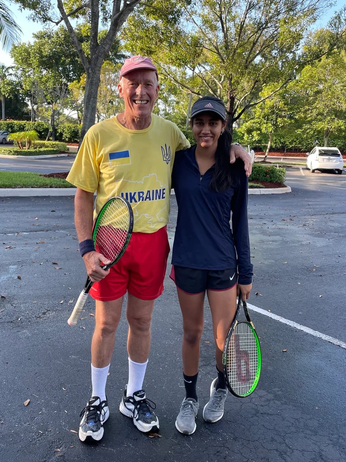 Coach Tim coaching a junior player